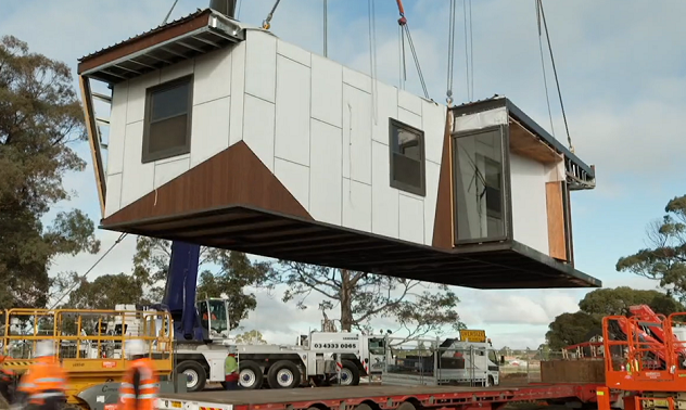 Crane lifts a module