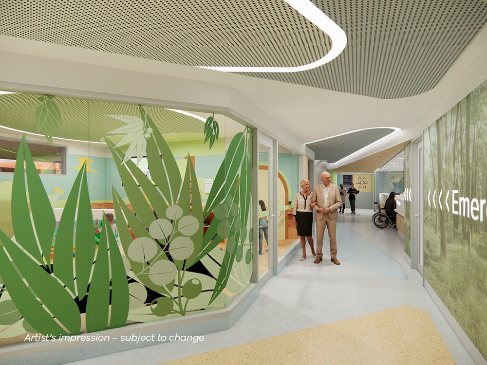 Two people walking down the hospital corridor