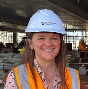 Close up of a woman wearing a hard hat
