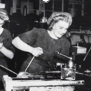Black and white historical image of woman in a factory