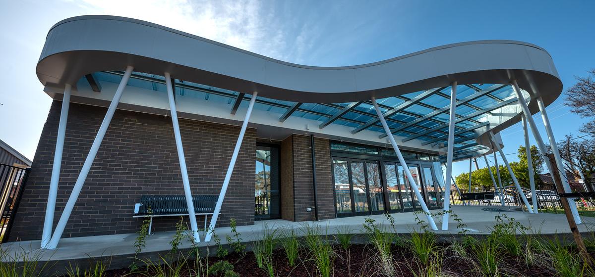 Exterior of the Echuca Cancerand Wellness Centre, with a brick facade and glass awning
