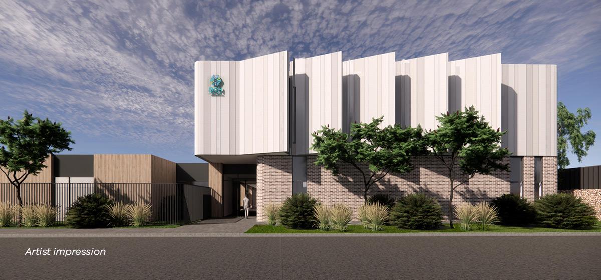 Artist impression of the Phillip Island Community Hospital exterior. The bottom half is brick, and the top half is white and grey panelling.