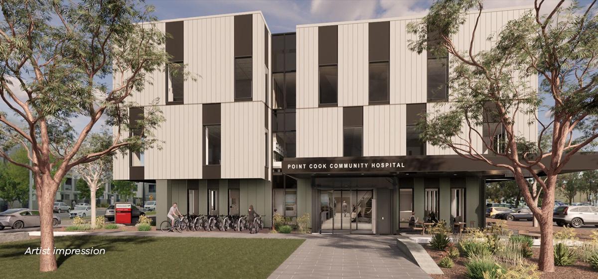 Building with white and black facade surrounded by greenery