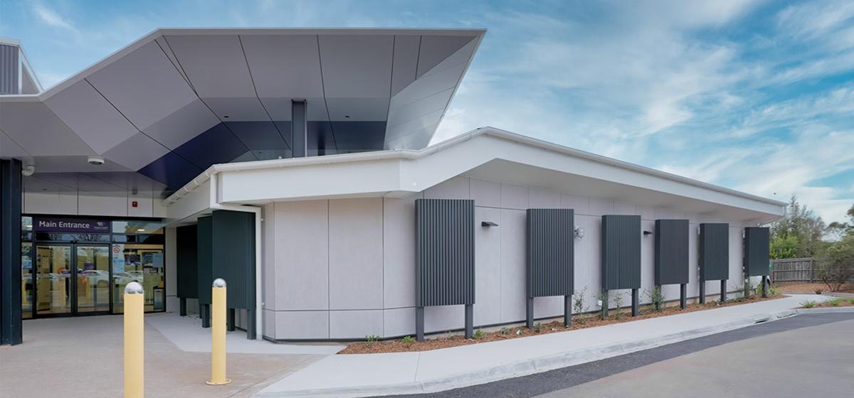 A modern building with a grey and black facade