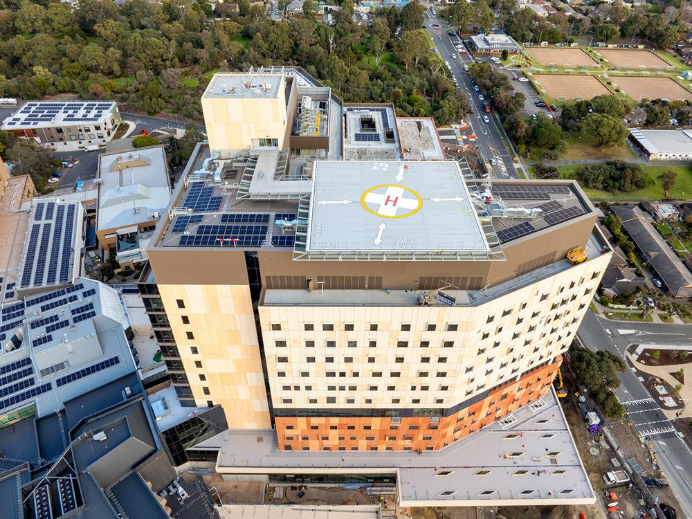 Bird's eye view of hospital rooftop with helipad