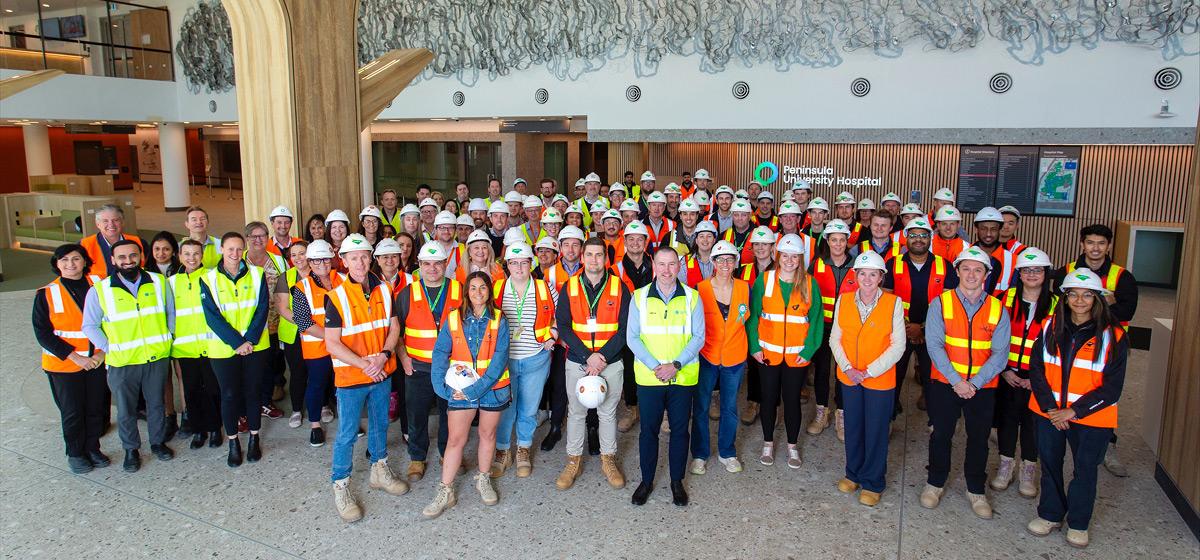 A group of people in hi vis and hard hats