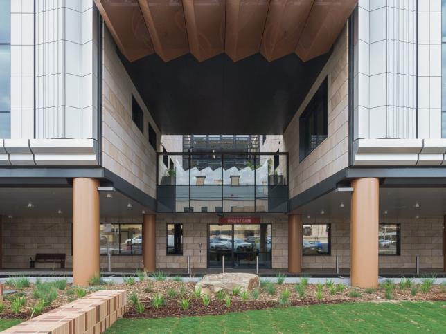 Entrance to an Urgent Care Centre, with sandstone brick facade