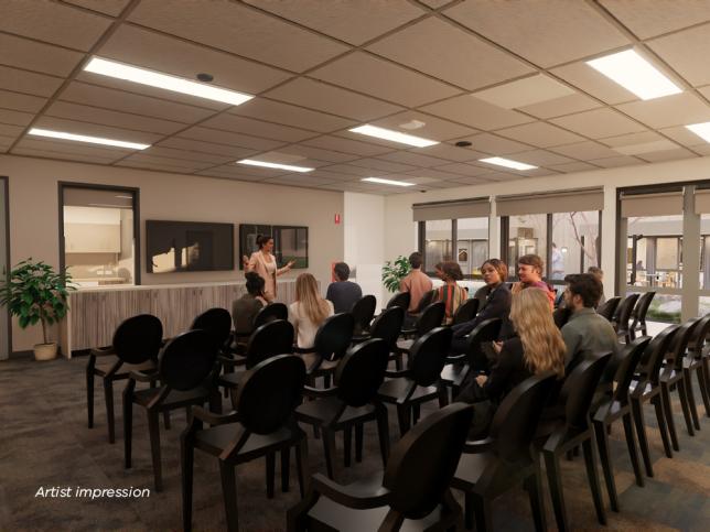 Artist impression of a multi-purpose room filled with rows of seats