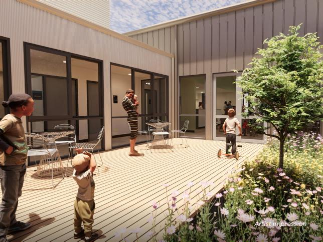 Artist impression of an outdoor space with timber decking and greenery
