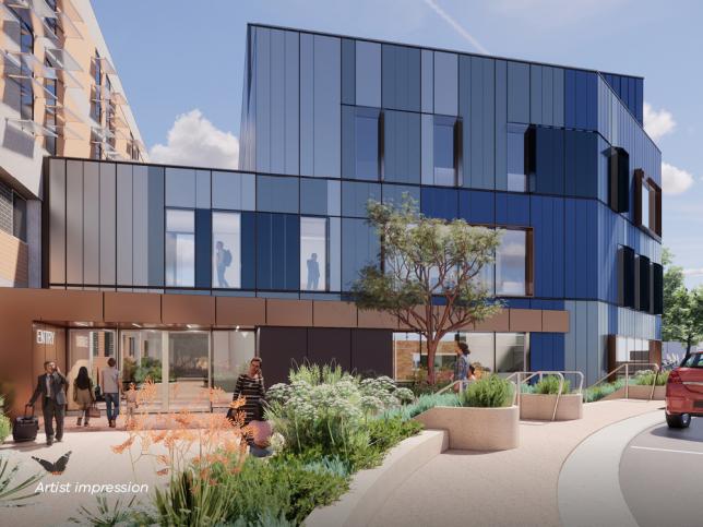 A striking two-storey building with a distinctive blue glass facade