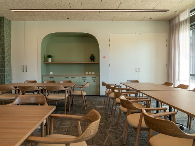 A dining with large wooden tables and chairs