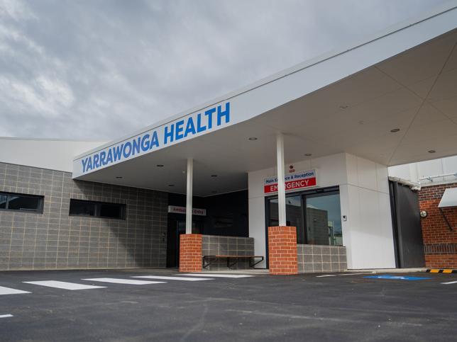 Hospital main entrance with driveway and signage