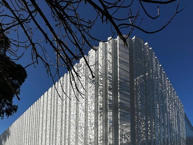 A close up a striking white building facade