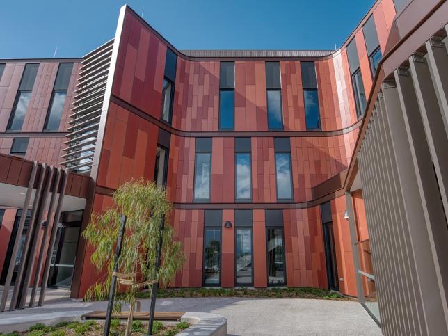 Close up of striking red building facade