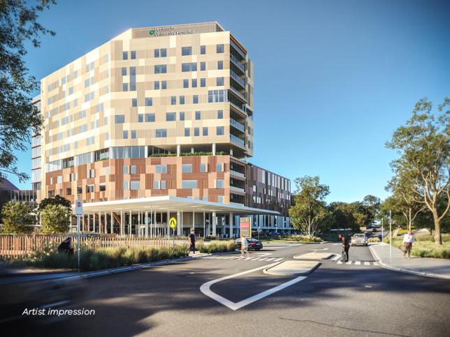 Artist's impression of the exterior of a hospital, featuring a modern multi-story building with a public road in the foreground where pedestrians are crossing and vehicles are passing.