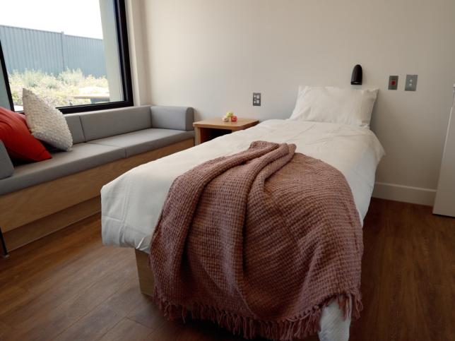 A bedroom with a large window