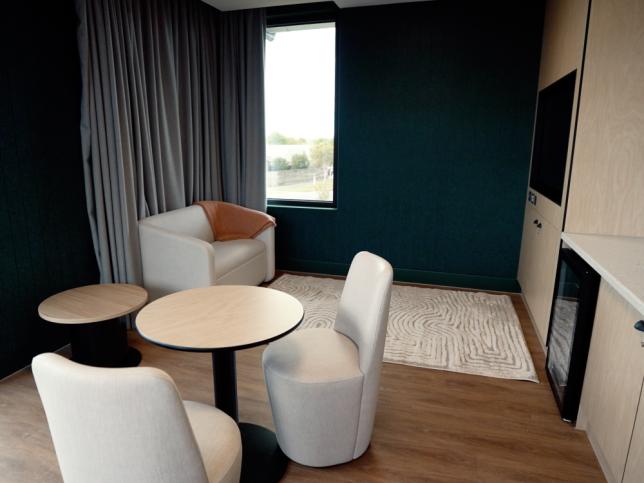 A kitchenette with table and chairs