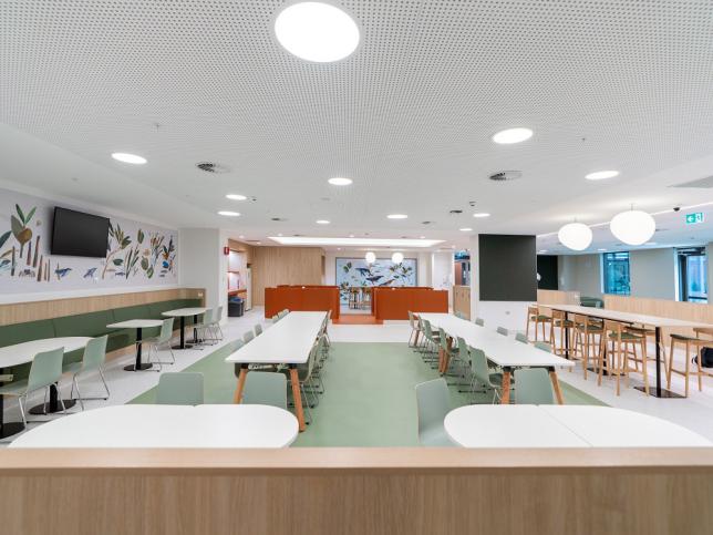 Large dining area with calm colours and different seating and table options