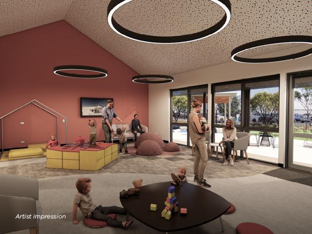 An artist's impression of a modern room with a play area. Children and adults engage in various activities. The room features circular ceiling lights, a colourful rug, large windows, and a playhouse structure.