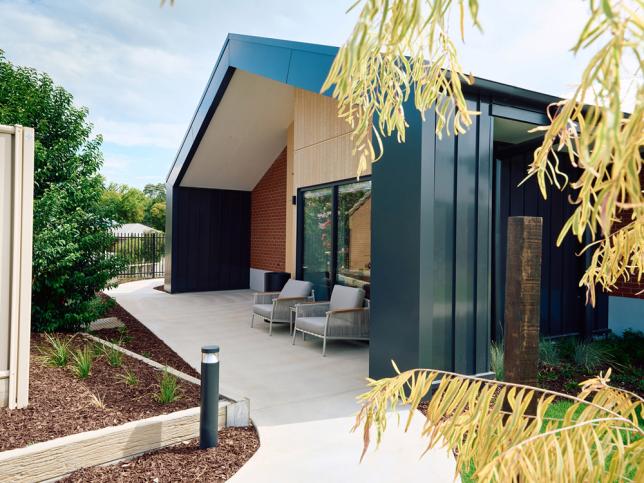 Side view of entrance with tree