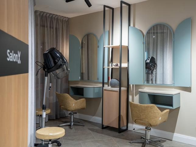 Hair salon with mirrors and equipment