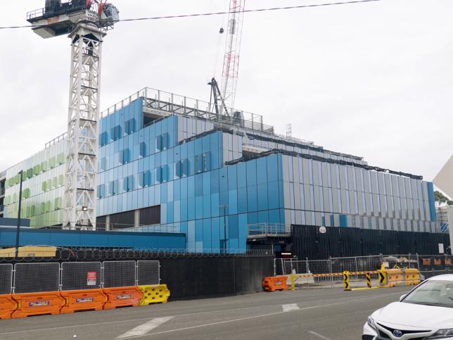 Construction of the Barwon Women's and Children's building, showing tower cranes and the coloured glass exterior under construction.
