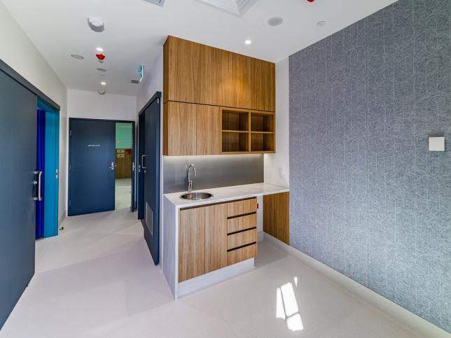 A room with a basin area