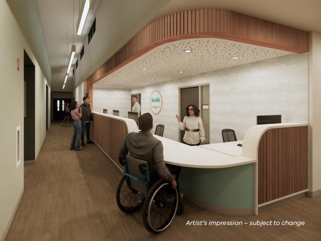 Artist's impression of the reception desk at the Northcote Early Parenting Centre, with a staff member greeting a visitor who uses a wheelchair.