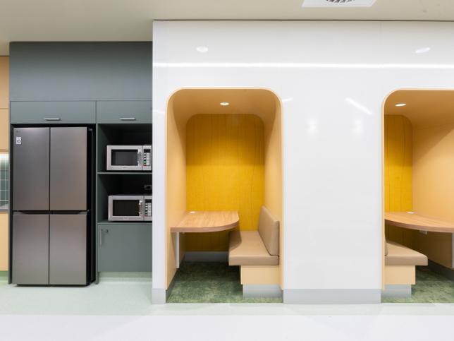 A modern kitchen with booth seating
