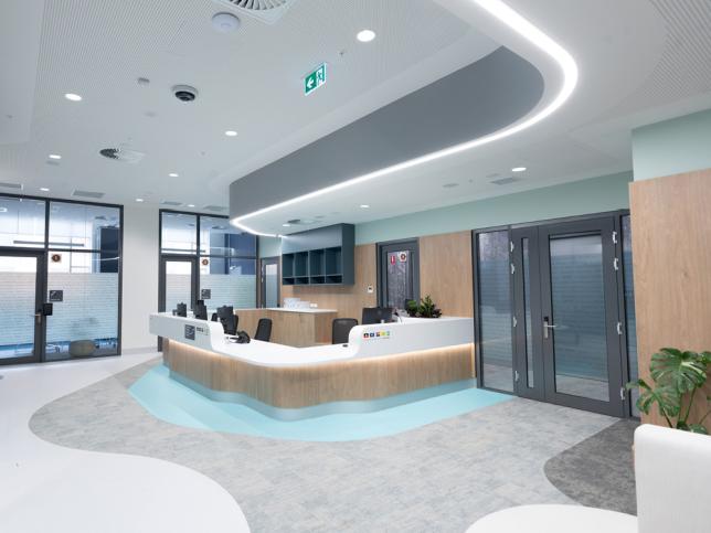A modern reception area with blue and grey decor