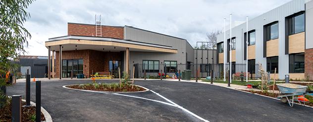 Driveway leading up to new and modern building