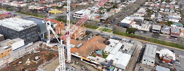 A view from above of tower cranes on a construction site