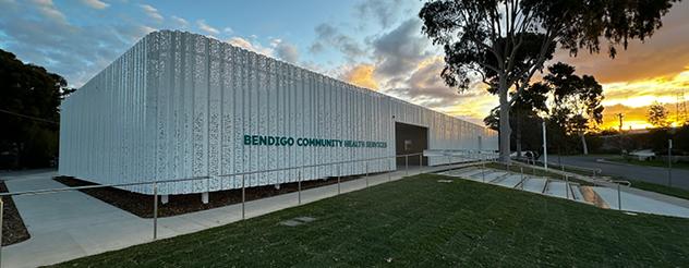 A modern building surrounded by bushland