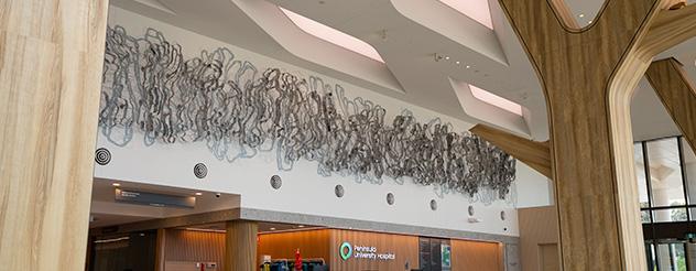 An artworks hangs proudly in a foyer