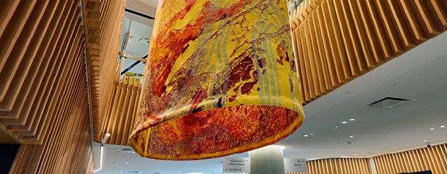 close up of cylindrical tapestry artwork