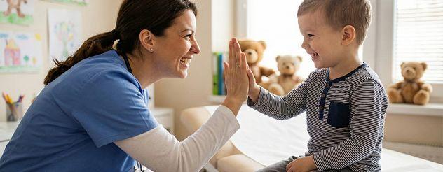 Nurse high fiving a child 