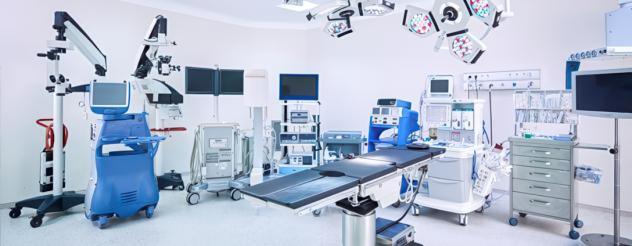 A hospital room with various medical equipment