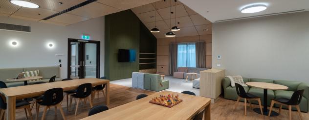 Communal living space with couches and tables
